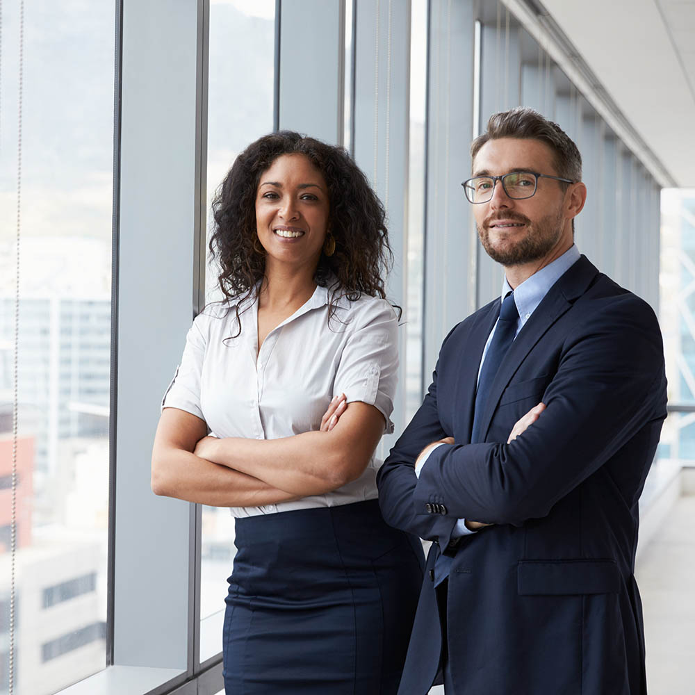 Portrait Of New Business Owners In Empty Office