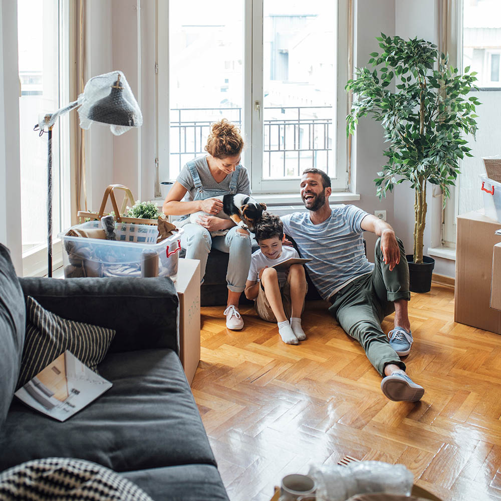 Husband and wife and their child moving in new home.