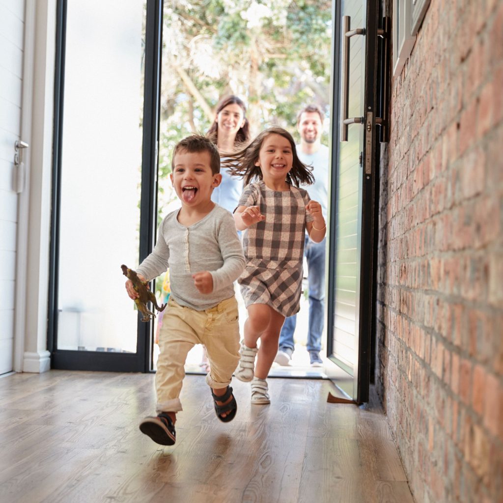 Two small kids running in indoor